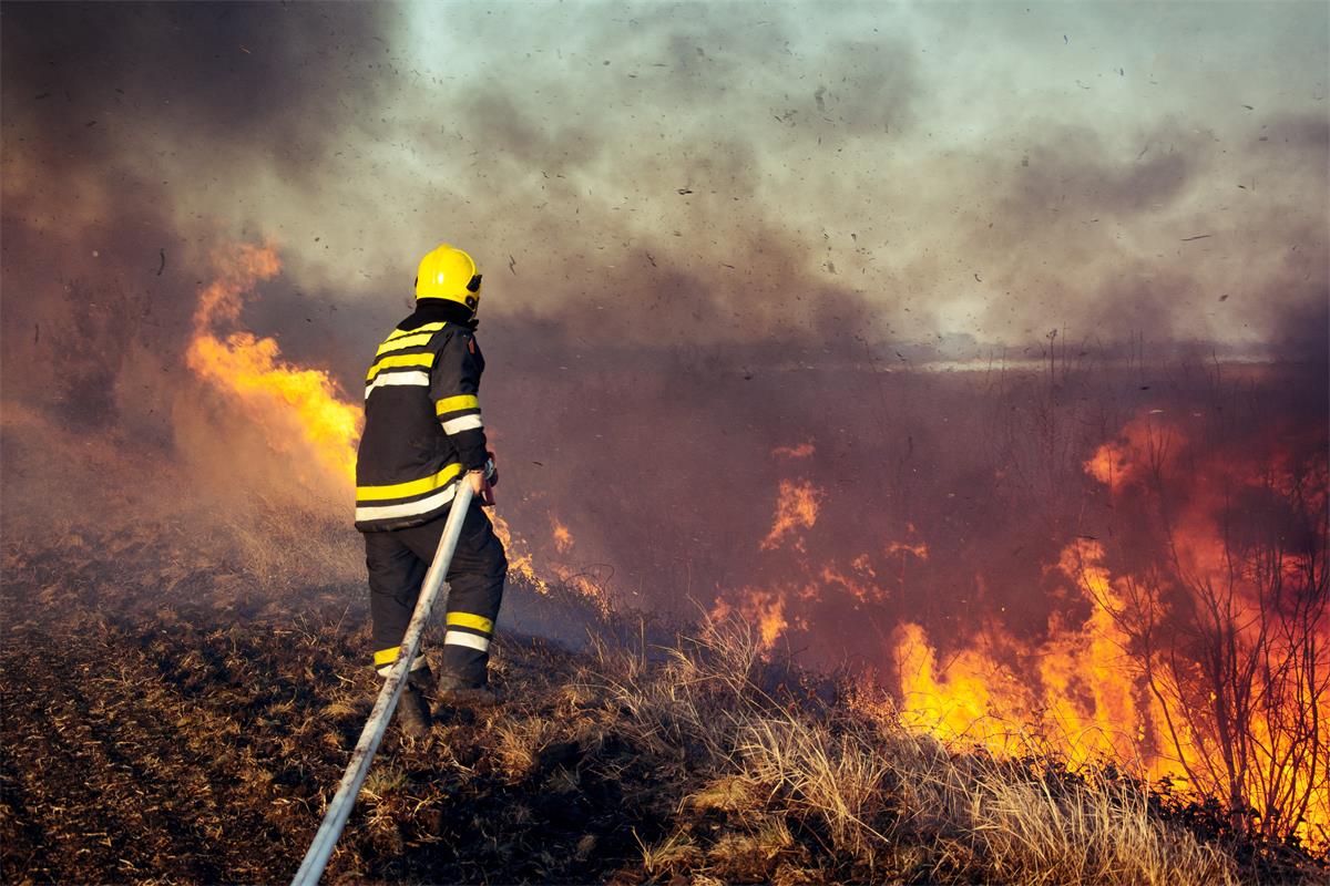 Firefighter battles a wildfire